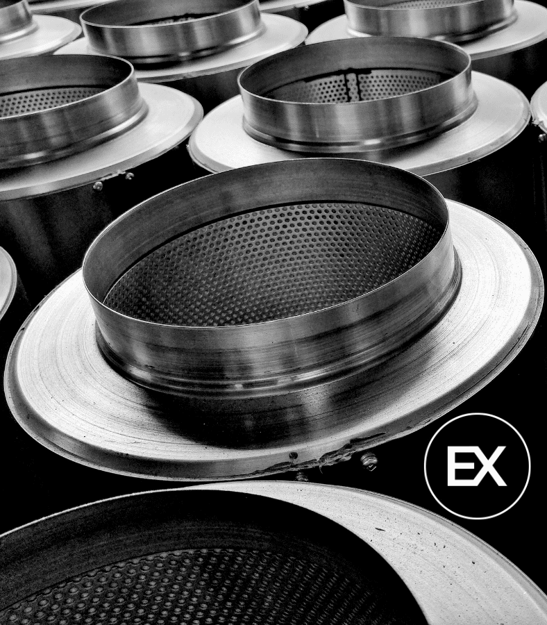 HVAC METAL SPINNING. Silencers are used in the HVAC industry, to silence noise from HVAC systems in ducting. They also regulate and control air pressure and flow. The end rings of attenuators are made using metal spinning. Excell Metal Spinning Ltd. regularly supplies end rings to the HVAC industry in the UK and overseas. This image features a stack of attenuators / silencers made by Excell Metal Spinning Ltd.
